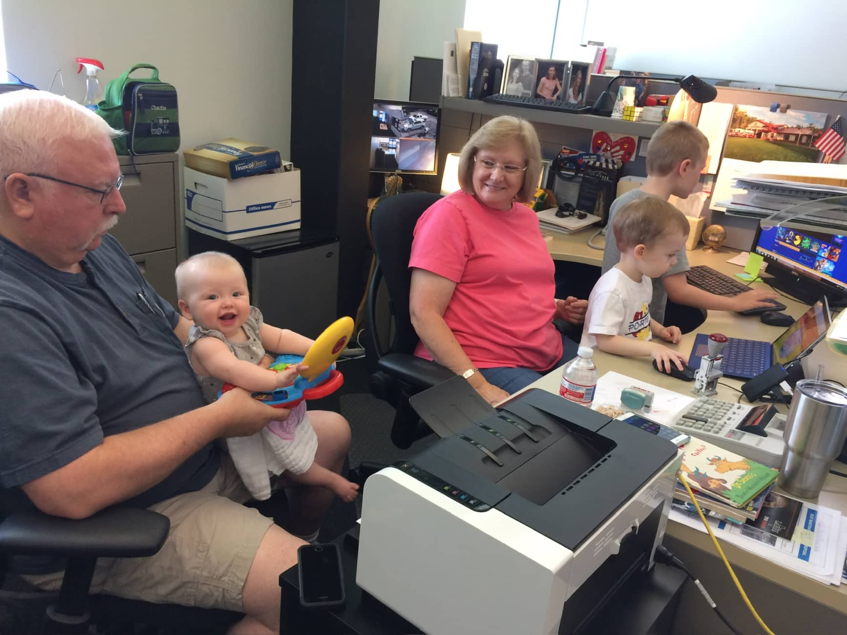 joan, terry and the grandkids in the office