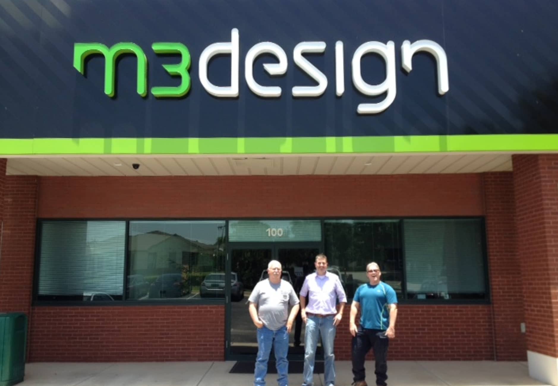 M3 founders in front of the new building