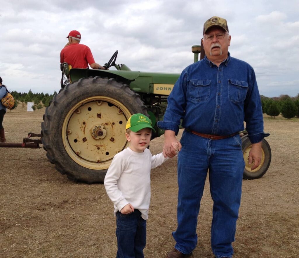 terry, grandson and tractor